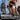 Woman lifts barbell in gym using lightweight and breathable stretch lycra clothing.
