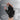 Glove worn on hand, padded with pull tabs, against a gray background highlighting its features.